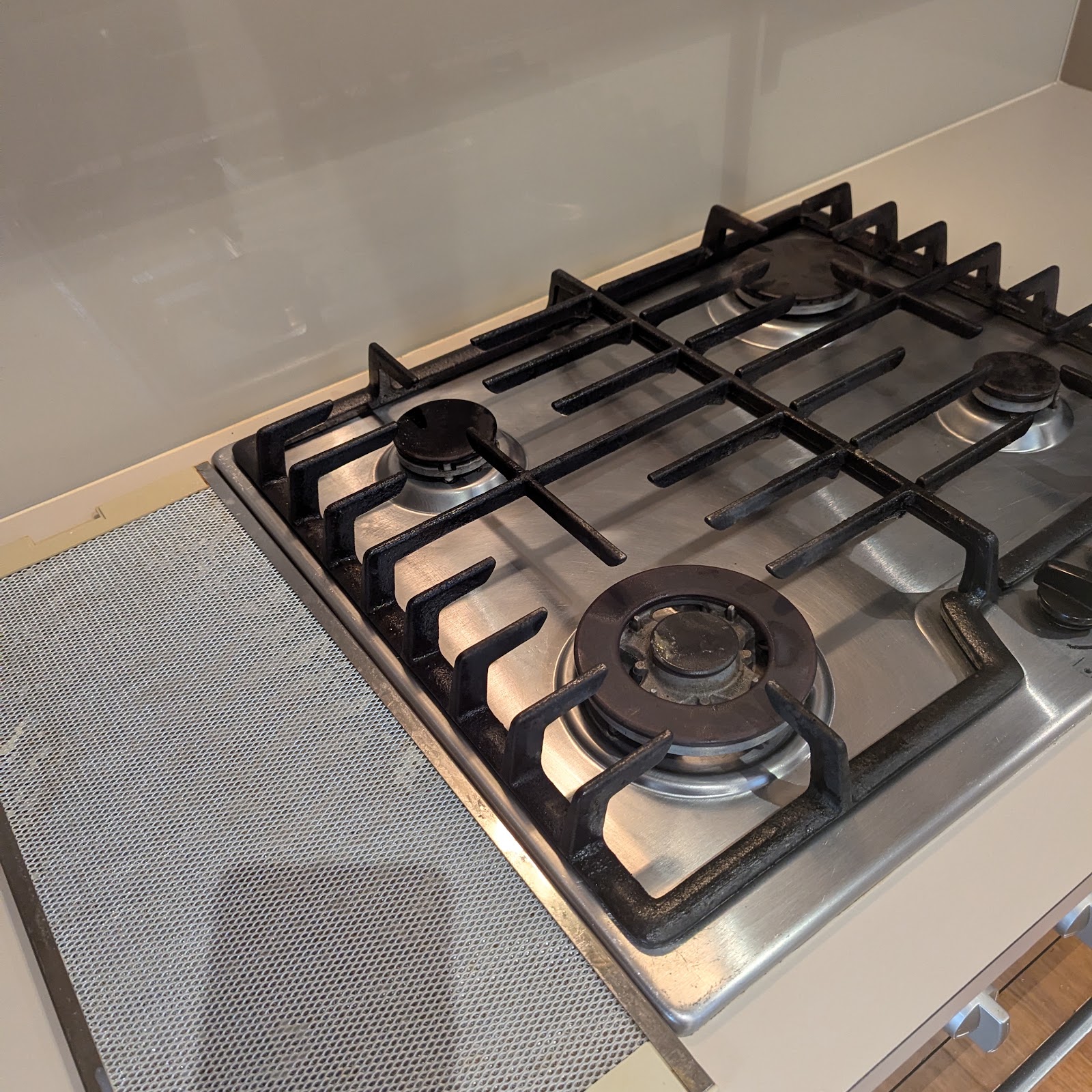 Gas cooktop grates removed for cleaning