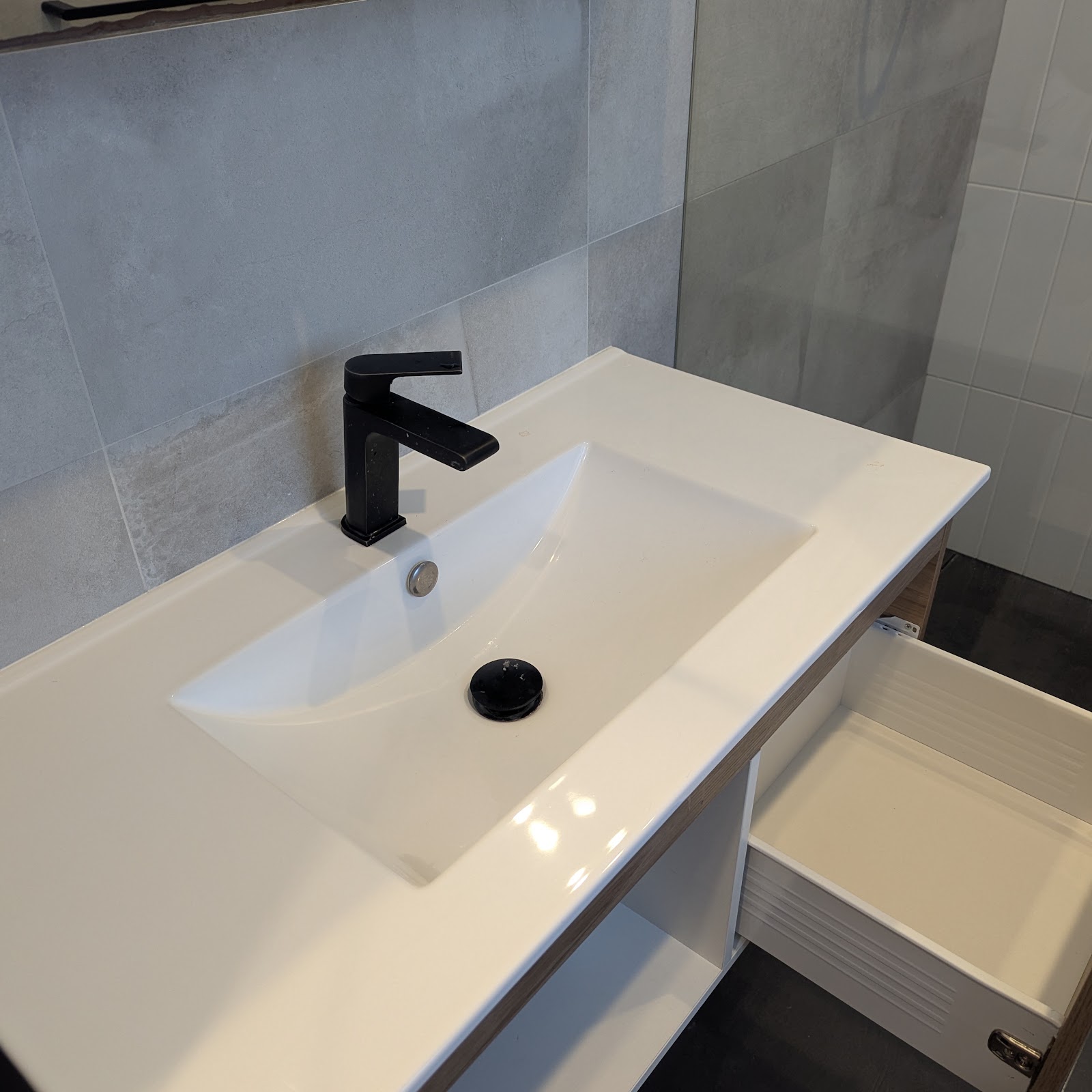 Bathroom vanity with black tapware